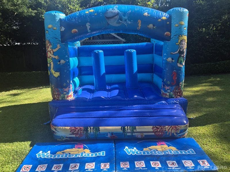 Under the Sea toddler castle with ocean artwork and a padded mat at the entrance