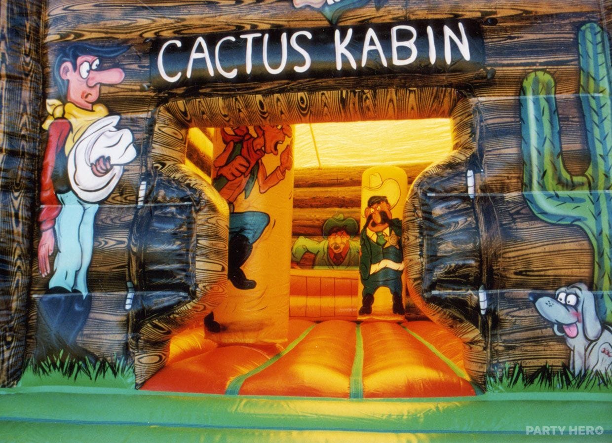 Cactus Kabin inflatable entrance with a cowboy mural