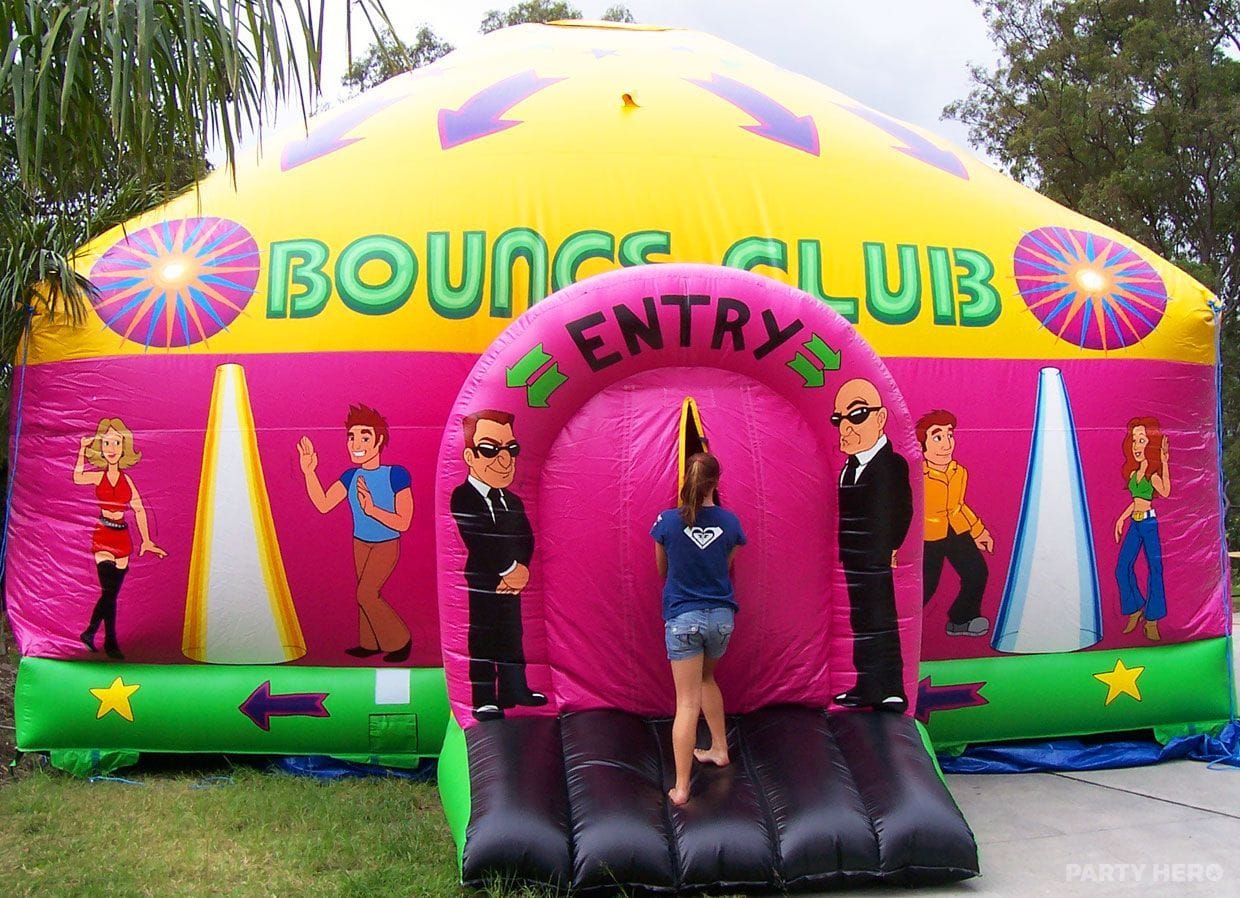 Bounce Club disco inflatable with a pink entry set up at an outdoor event