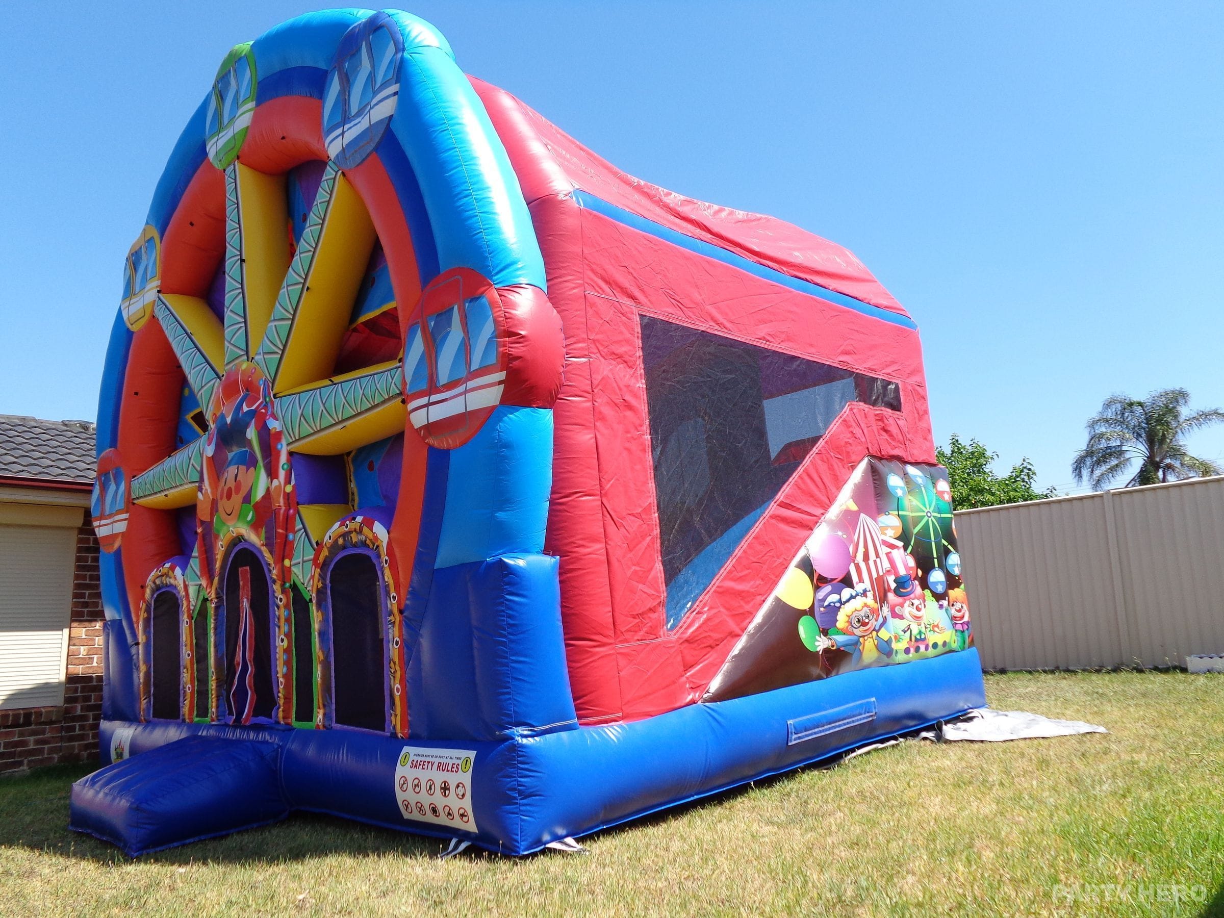 Side view of the Ferris wheel castle showing its enclosed jumping area and slide