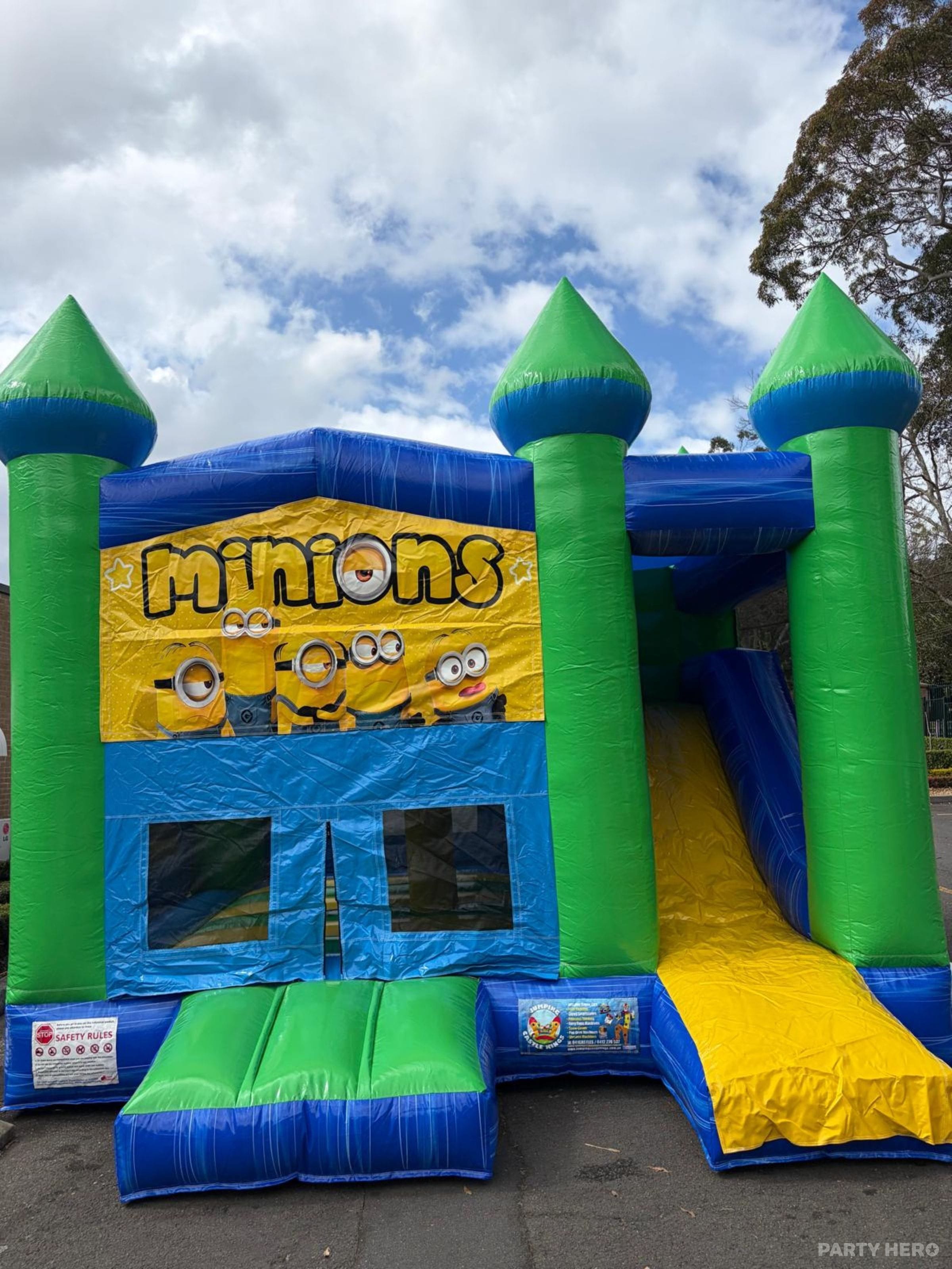 Minions combo castle with green turrets and a yellow slide